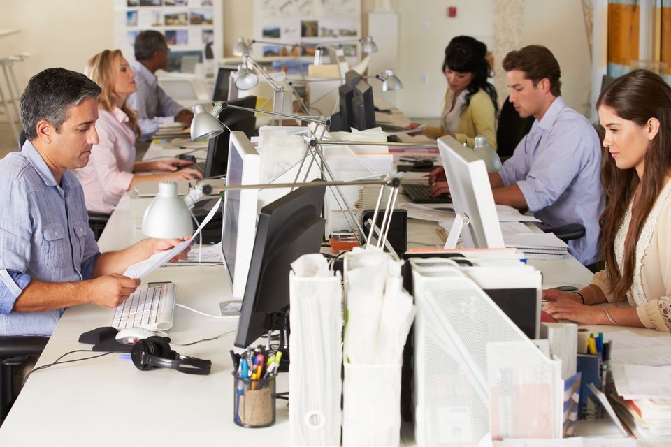 group of people sitting in an office