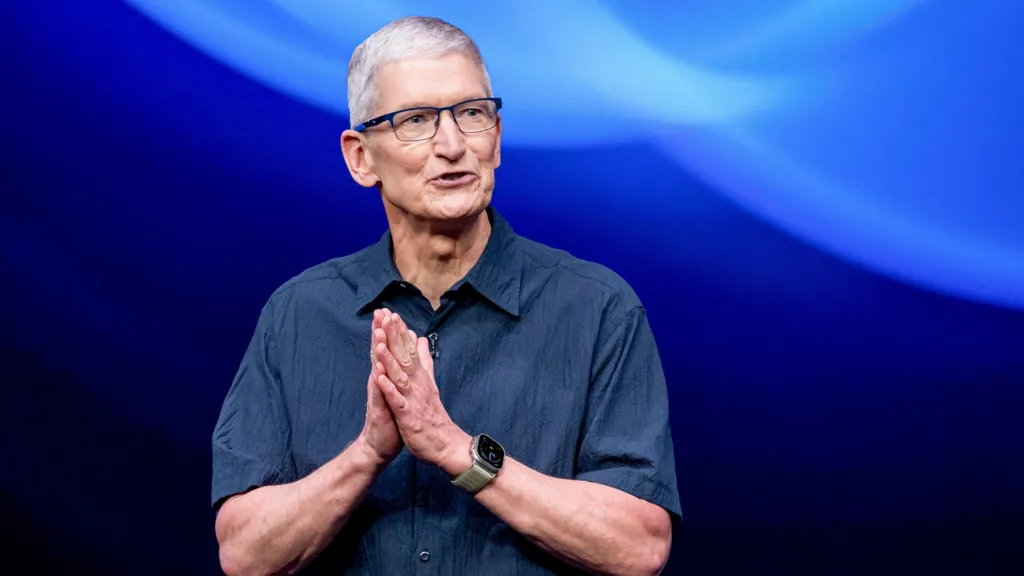 photo of tim cook, ceo of apple in front of a blue background